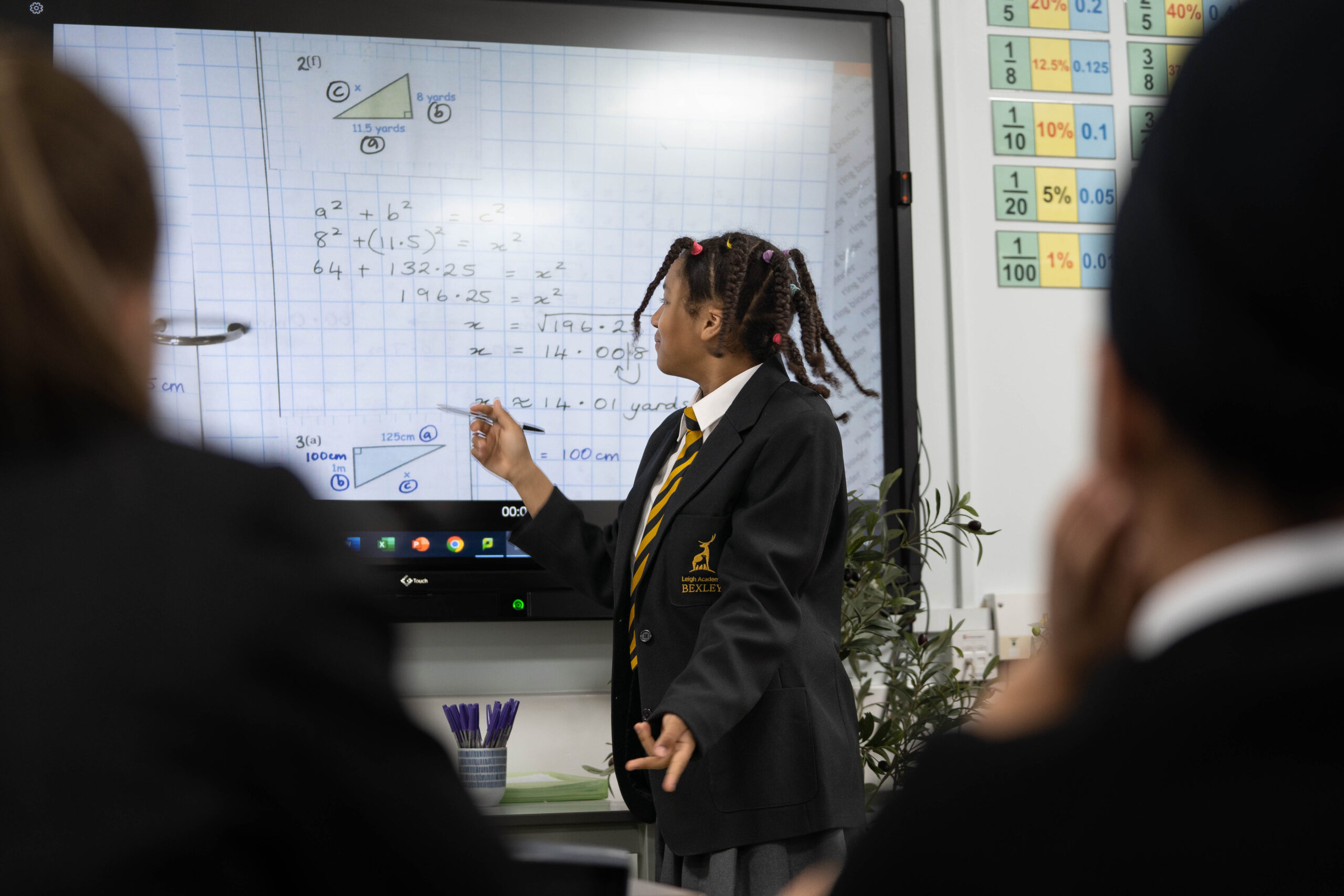 A student using an interactive whiteboard